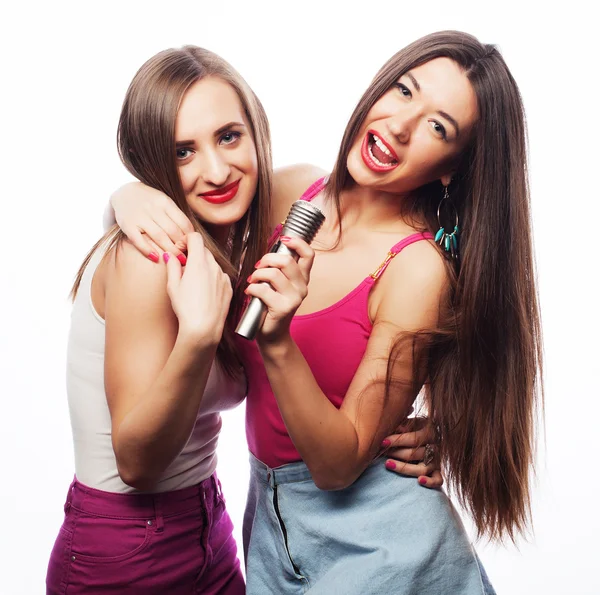 Sensual girls singing with microphone — Stock Photo, Image