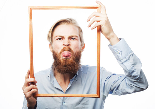 Young man holding picture frame