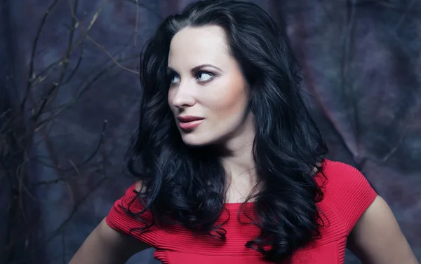 Young woman in red dress — Stock Photo, Image