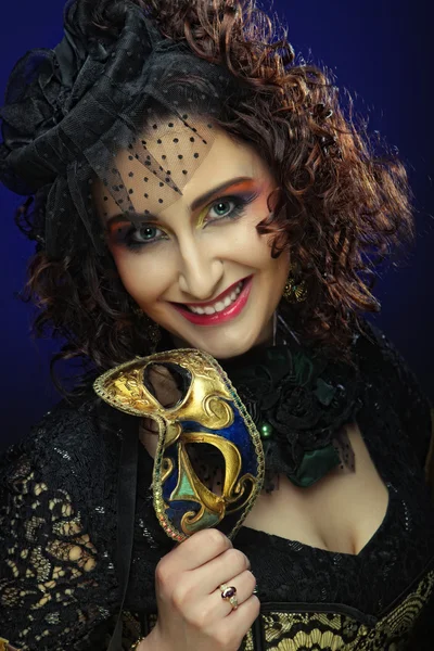 Curly woman with mask. Carnaval visage. — Stock Photo, Image