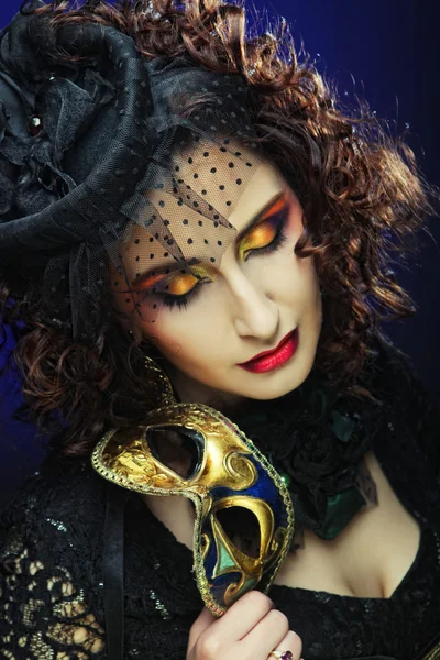 Curly woman with mask. Carnaval visage. — Stock Photo, Image