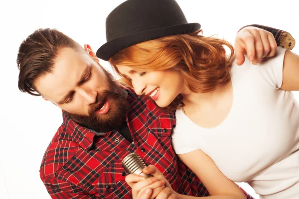 Lovely couple with microphone — Stock Photo, Image