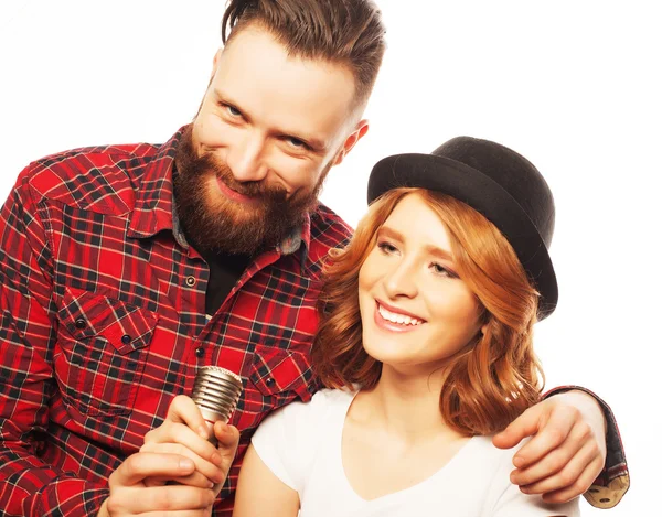 Lovely couple with microphone — Stock Photo, Image