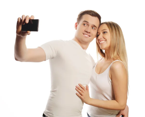 Sorrindo casal com smartphone — Fotografia de Stock