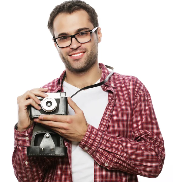 Young man with a retro camera — Stock Photo, Image