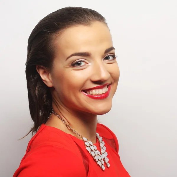 Young happy woman in red dress — Stock Photo, Image