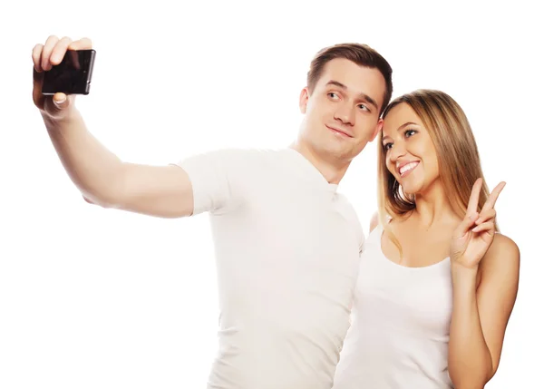 Smiling couple with smartphone — Stock Photo, Image