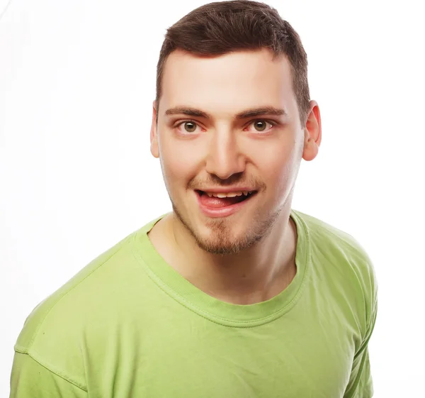 Boldog fiatalember, a zöld pólót — Stock Fotó
