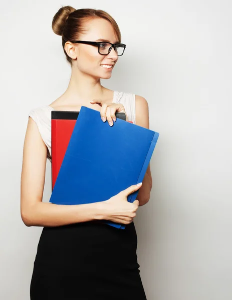 Young businesswoman holding folders — Stock Photo, Image