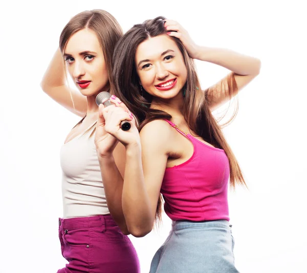 Sensual girls singing with microphone — Stock Photo, Image