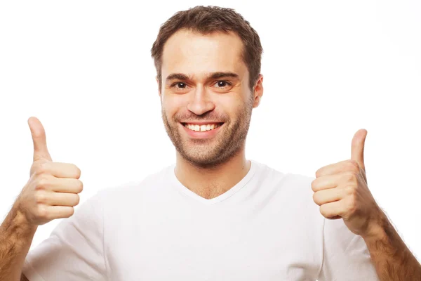 Feliz homem bonito mostrando os polegares para cima — Fotografia de Stock