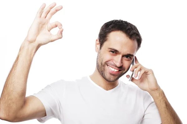 Casual young man showing thumbs up sign — Stock Photo, Image