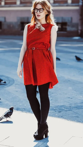 Young hipster woman wearing red dress — Stock Photo, Image