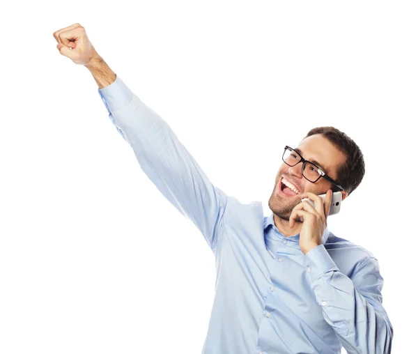 Успешный жест делового человека с мобильным телефоном — стоковое фото