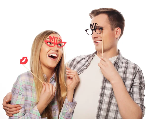 Lovely couple holding party glasses on stick — Stock Photo, Image