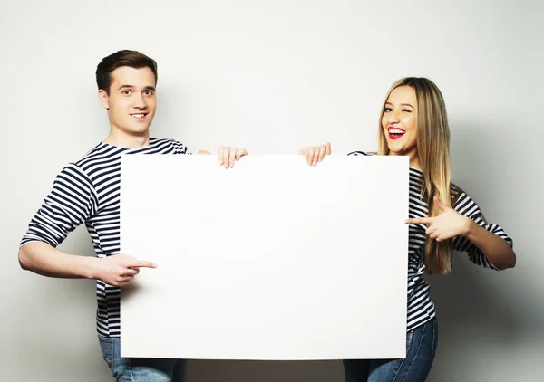 Couple holding a banner — Stock Photo, Image