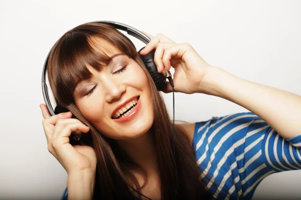 Young happy woman with headphones — Stock Photo, Image