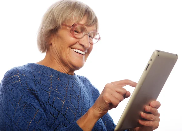 Senior happy woman using ipad — Stock Photo, Image