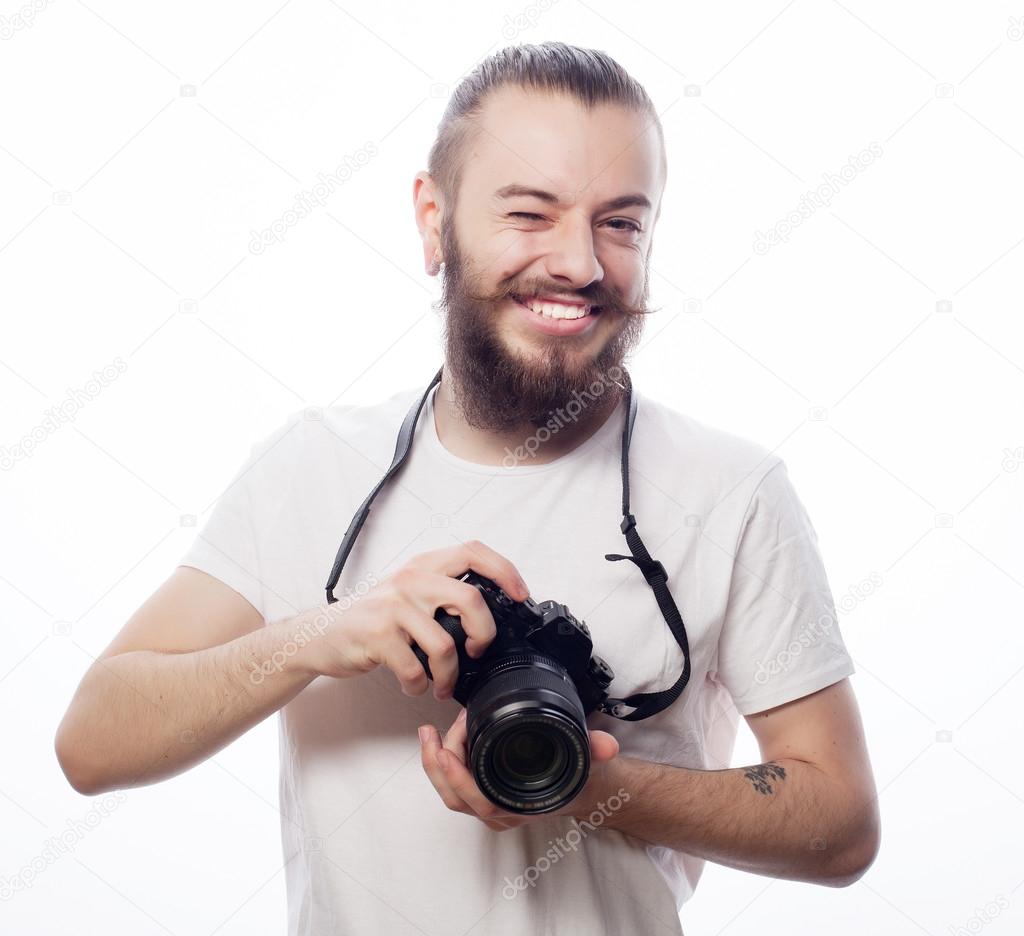 bearded man with a digital camera