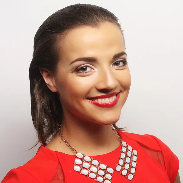 Young happy woman in red dress — Stock Photo, Image