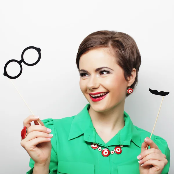 Woman holding mustache and glasses — Stock Photo, Image