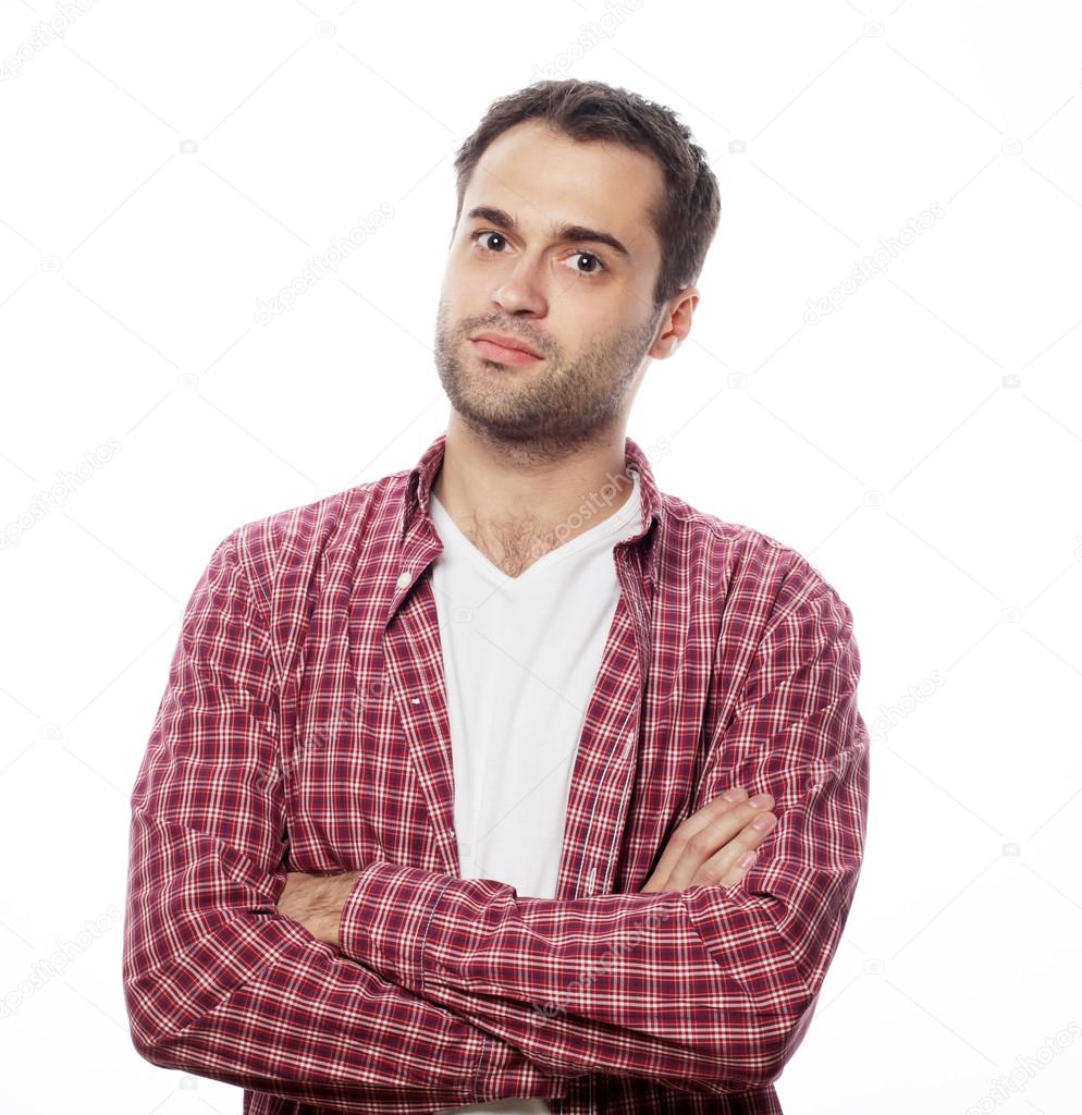 Handsome young man in shirt looking at camera 