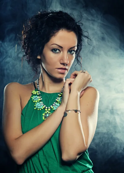 Beautiful woman in green dress — Stock Photo, Image