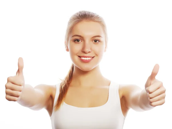 Happy smiling young woman with thumbs up gesture — Stock Photo, Image