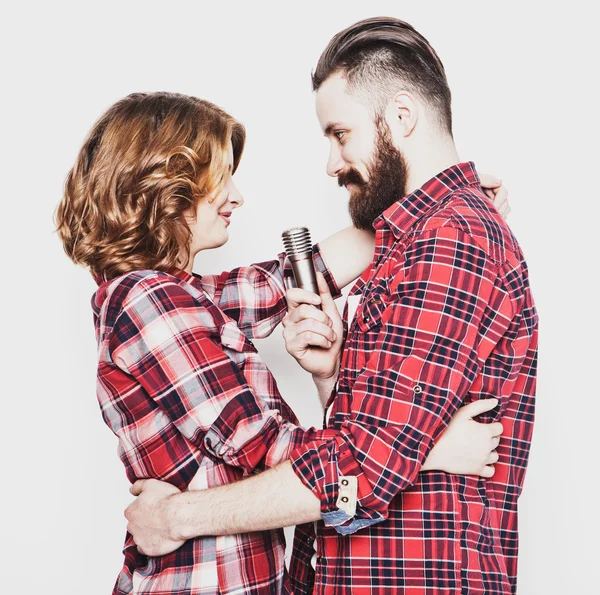 Lovely couple with microphone — Stock Photo, Image