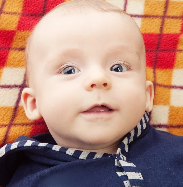 Smiling child with blue eyes — Stock Photo, Image
