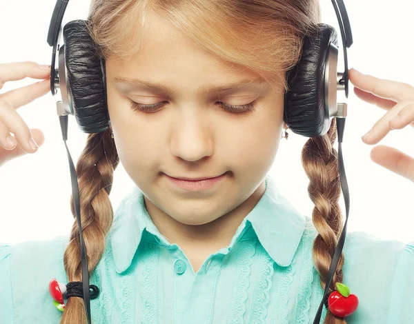 Beautiful happy little girl with headphones — Stock Photo, Image