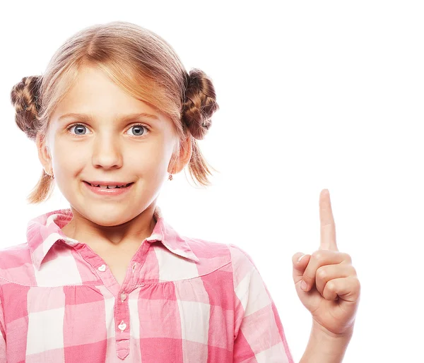 Linda chica de la escuela señalando su dedo índice —  Fotos de Stock