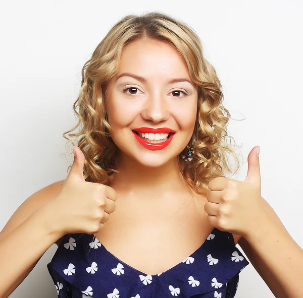 Happy smiling beautiful young woman showing thumbs up gesture — Stock Photo, Image