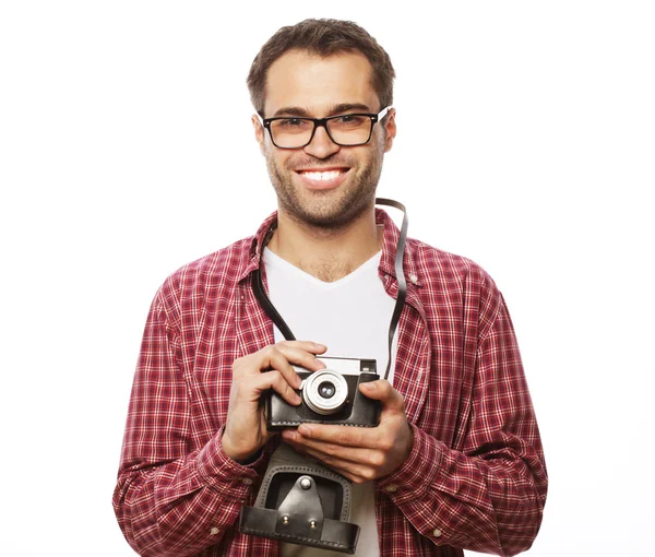 Young man with a retro camera — Stock Photo, Image