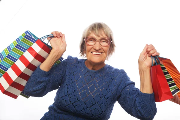 Mujer mayor feliz con bolsas de compras —  Fotos de Stock