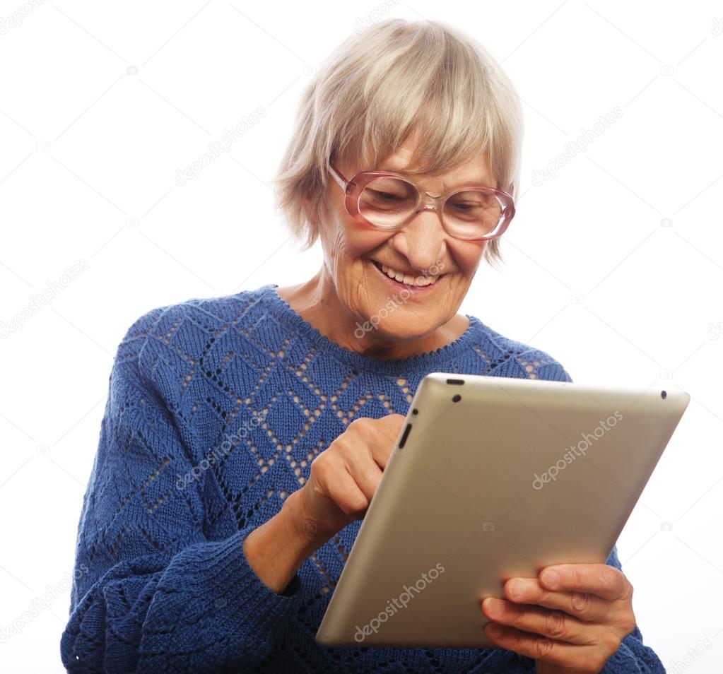 Senior happy woman using ipad  