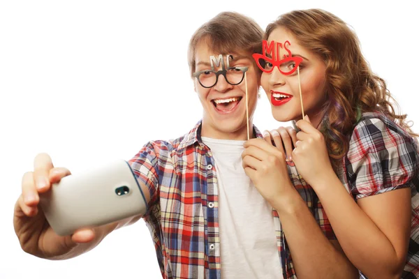 Smiling couple with smartphone, selfie and fun. — Stock Photo, Image