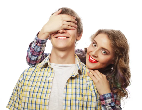 Young woman closing his boyfriend eyes. — Stock Photo, Image