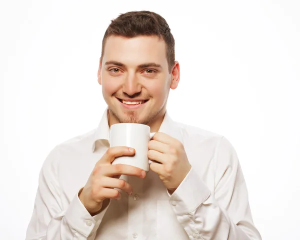 Hombre sosteniendo taza blanca con café — Foto de Stock