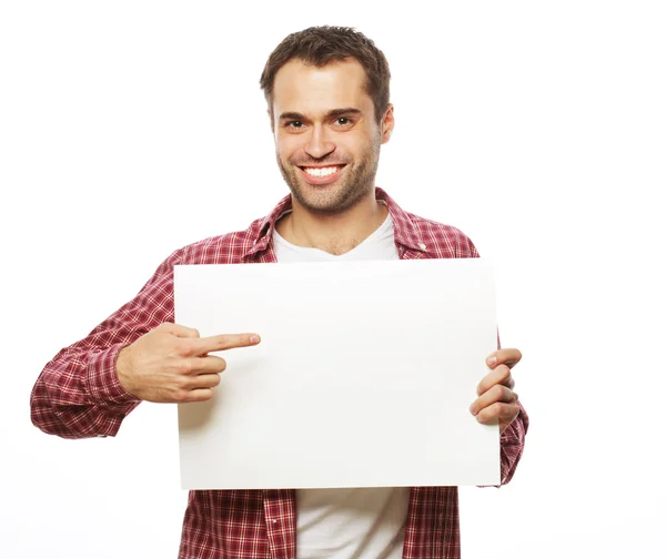 Joven barbudo mostrando letrero en blanco — Foto de Stock