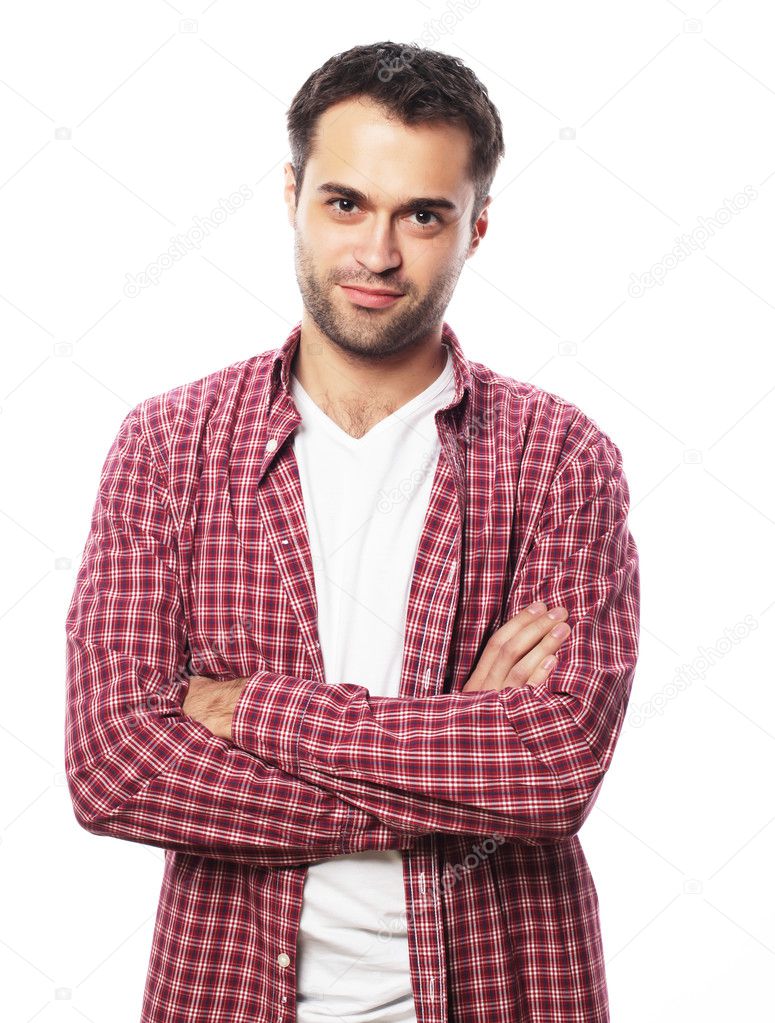 Handsome young man in shirt looking at camera 