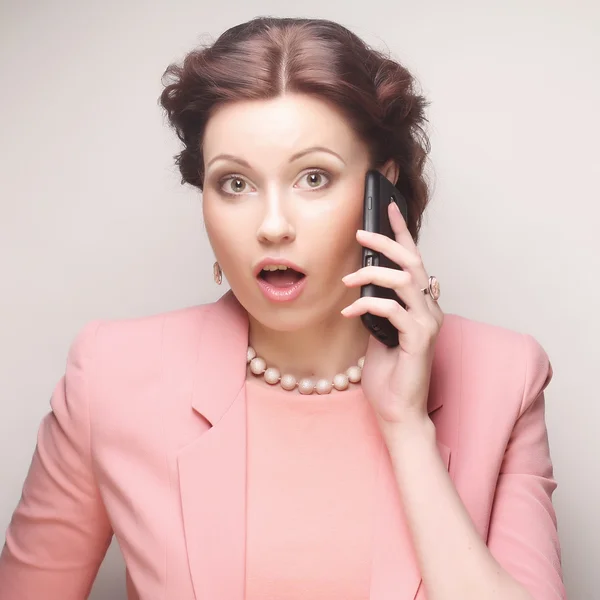 Funny businesswoman with mobile phone — Stock Photo, Image