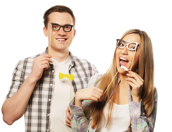 Lovely couple holding party glasses on stick — Stock Photo, Image