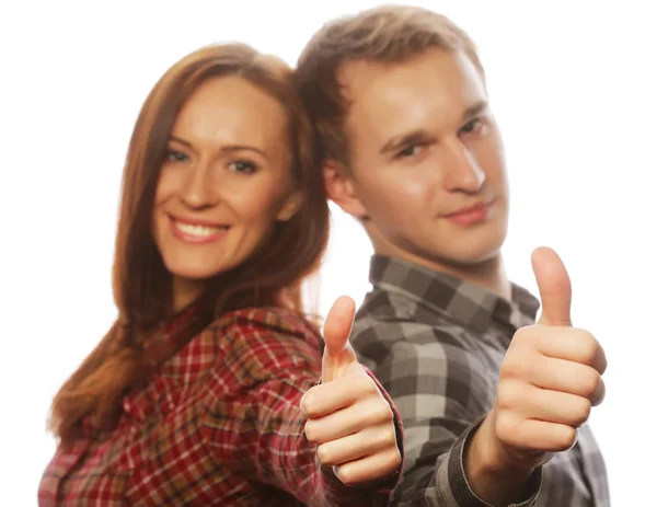 Lovely couple with thumbs-up gesture — Stock Photo, Image