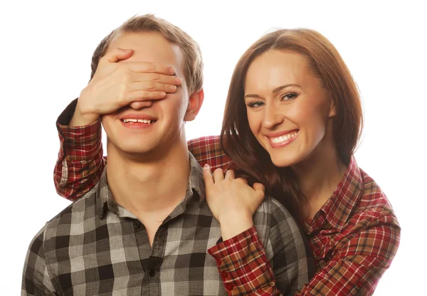 Young woman closing his boyfriend eyes. — Stock Photo, Image