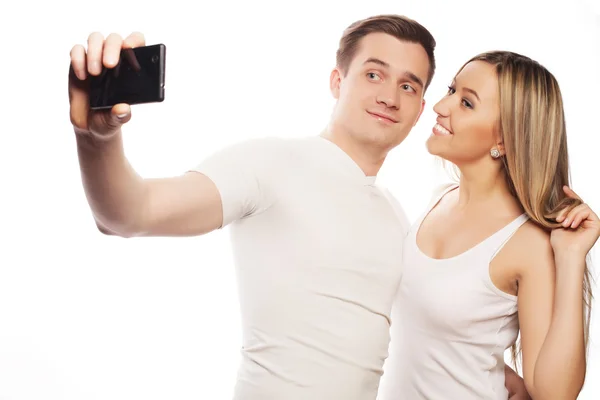 Smiling couple with smartphone — Stock Photo, Image