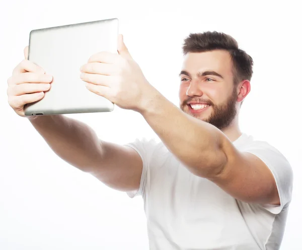 Young bearded man holding tablet — Stock Photo, Image