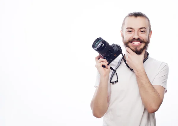 Vousatý muž s digitálním fotoaparátem — Stock fotografie