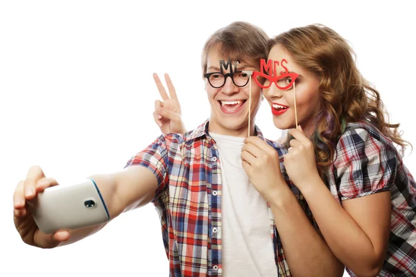 Smiling couple with smartphone, selfie and fun. — Stock Photo, Image