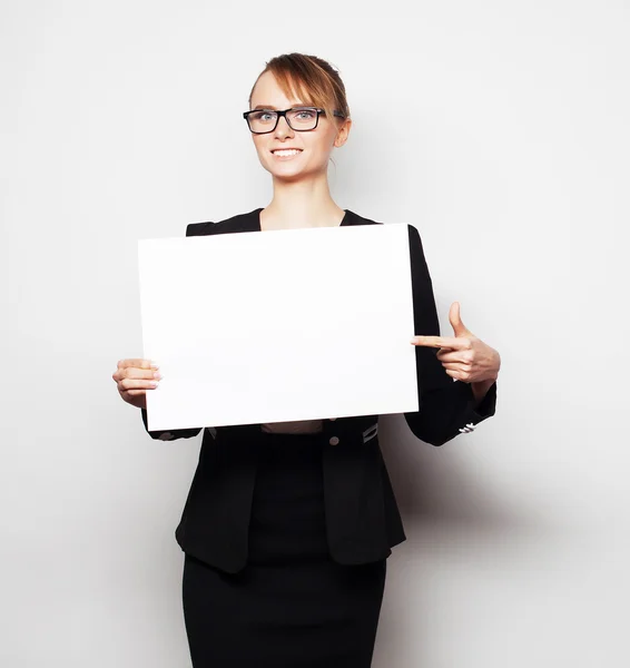 Business woman holding a blank billboard. — Stock Photo, Image